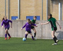 Female students playing football